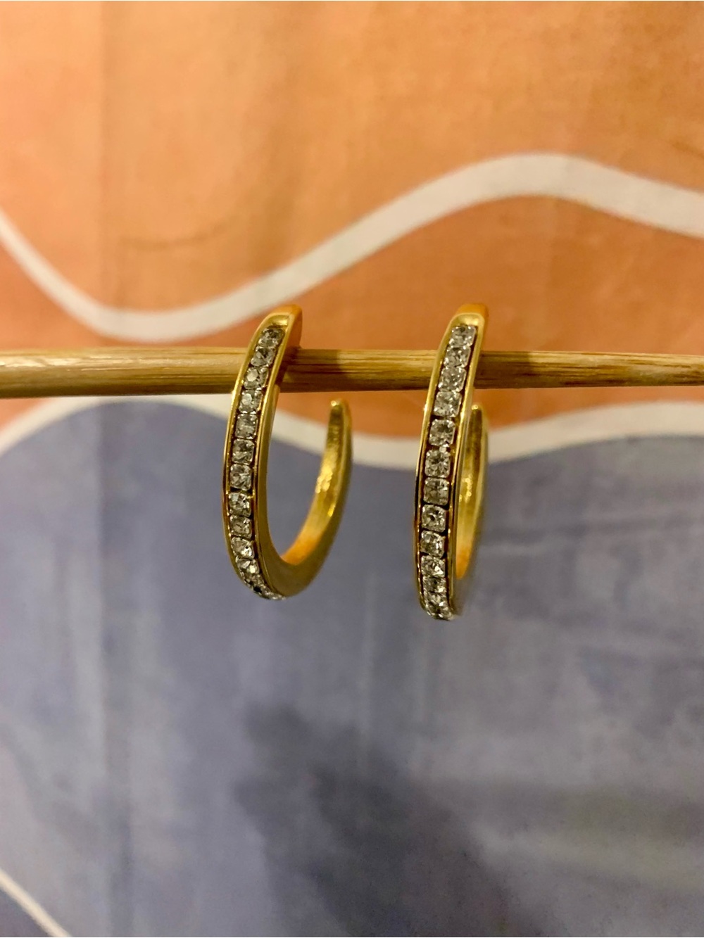 Gold tone open hoop earrings with rhinestones